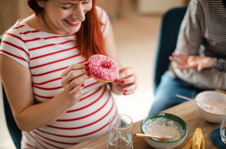 pregnancy craving woman with donut