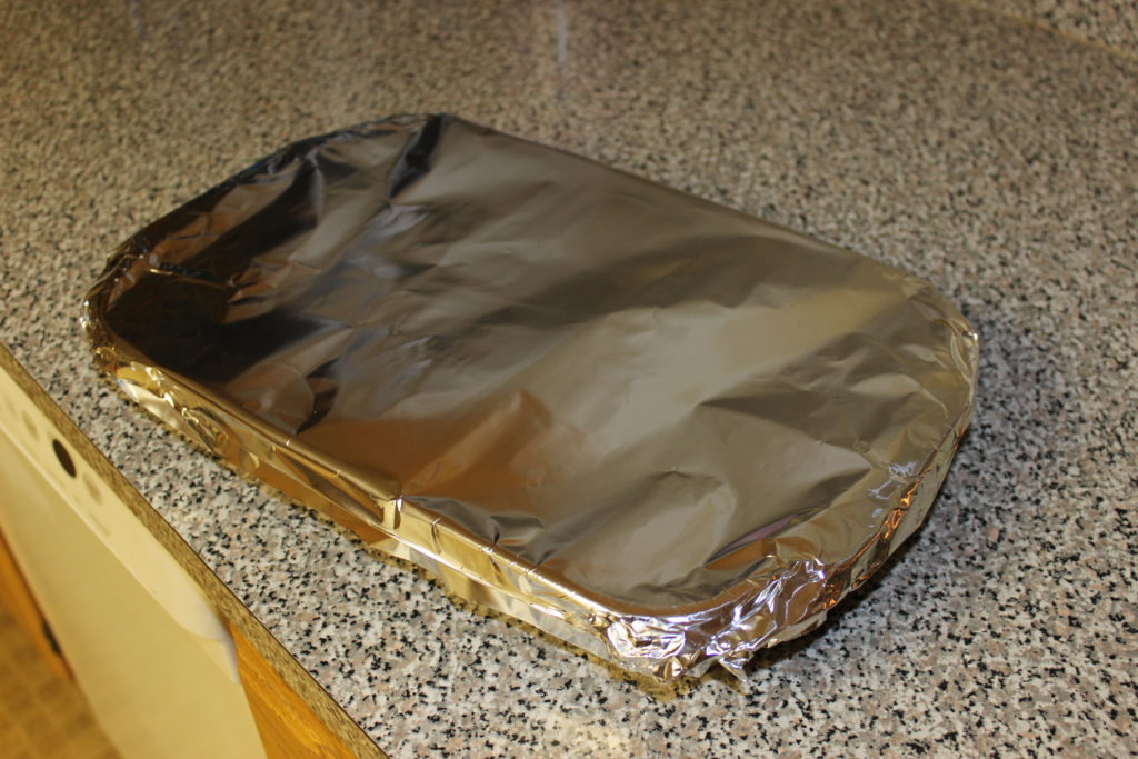 Casserole covered with aluminum foil