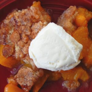 HOMEMADE PEACH COBBER WITH WHIPPED CREAM