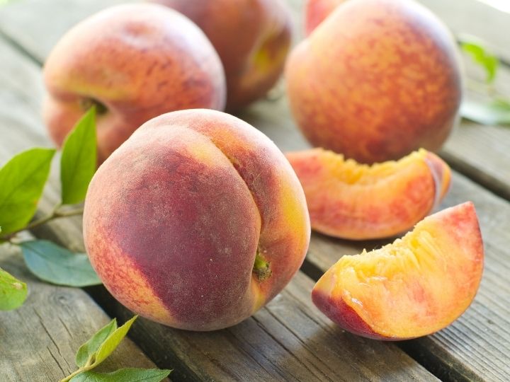 fresh peaches on table