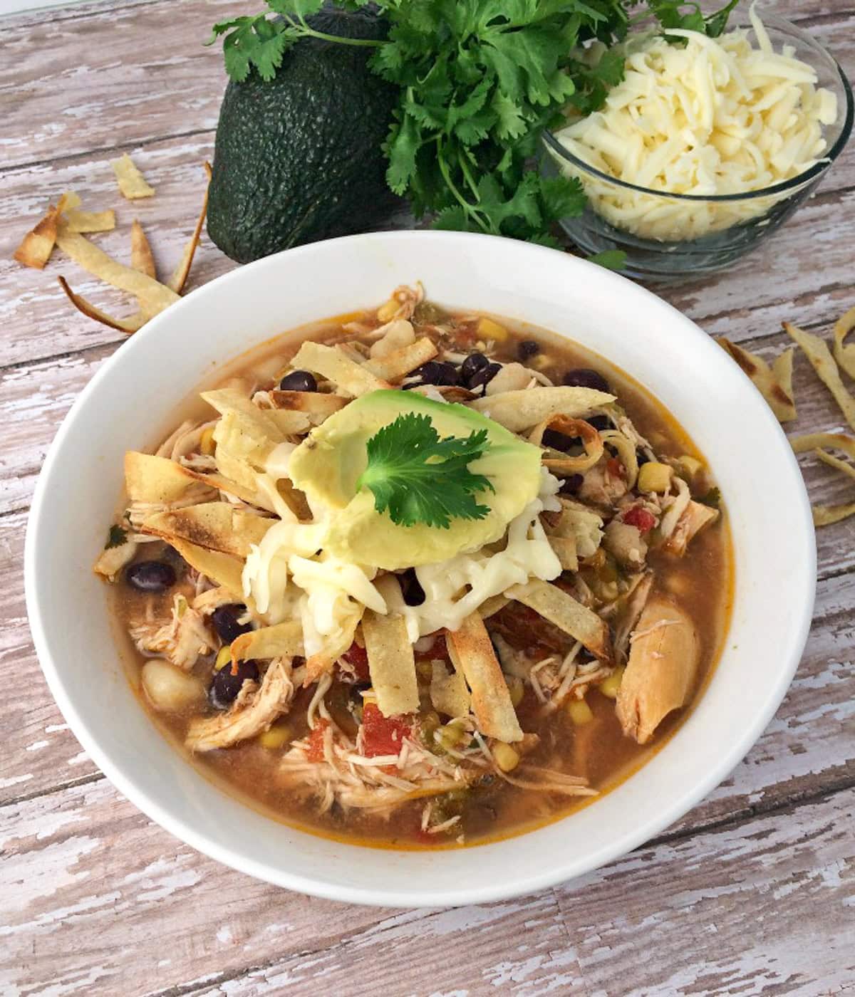bowl of slow cooker chicken tortilla soup.